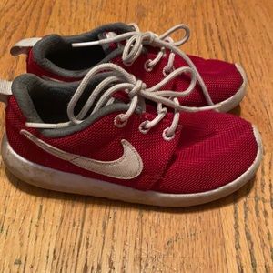Boys red Nike shoes